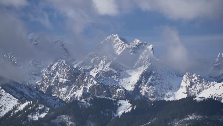 Clouds Covering Snow Capped Peaks of Tatra Moutains during high speed  wind, Slovakia.