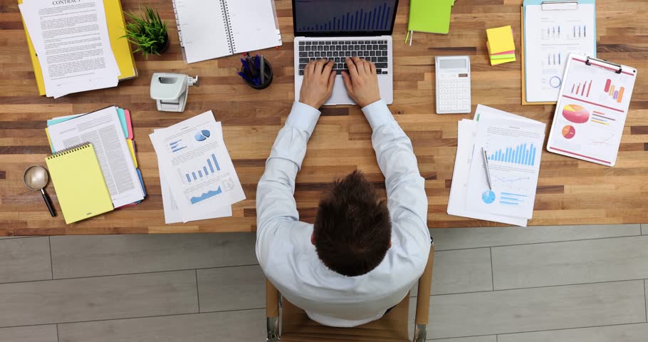 Businessman typing on laptop keyboard and closing lid at end of working day top view 4k movie. Time management and finish last assignment concept