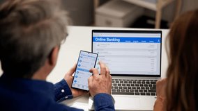 Couple Checking Bank Account Online At Home - Powered by Shutterstock - Get 15% off with code: PIKWIZARD15