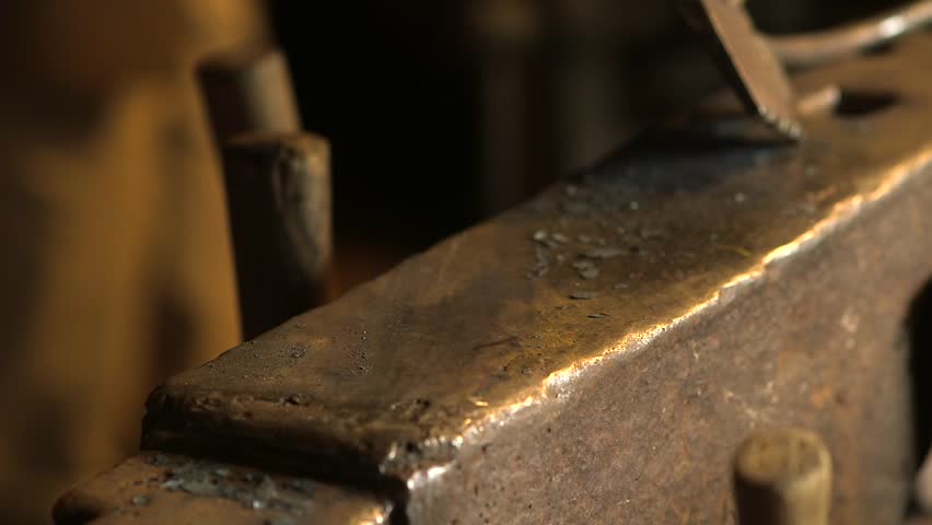 Blacksmith on an Anvil Forges Hot Iron, Makes a Horseshoe. A Blacksmith is a Metalsmith Who Creates Objects Primarily from Wrought Iron or Steel, but Sometimes From Other Metals.
