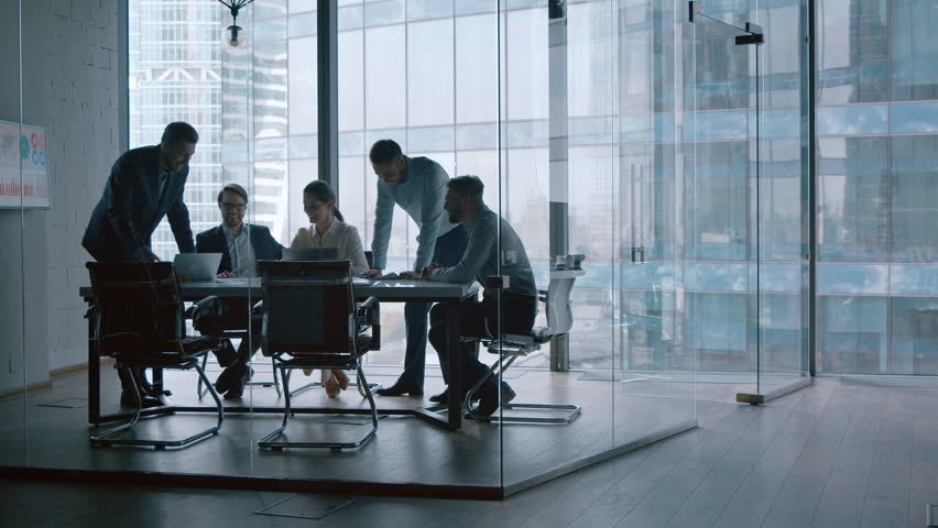 Startup business: mature people in suits discussing new projects