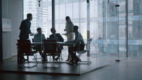 Mature businesswoman telling colleagues her development vision at a meeting - Powered by Shutterstock - Get 15% off with code: PIKWIZARD15