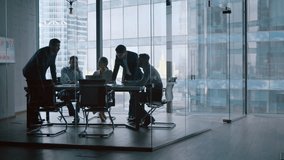 Teamwork: young business people discussing holding a presentation in modern office - Powered by Shutterstock - Get 15% off with code: PIKWIZARD15