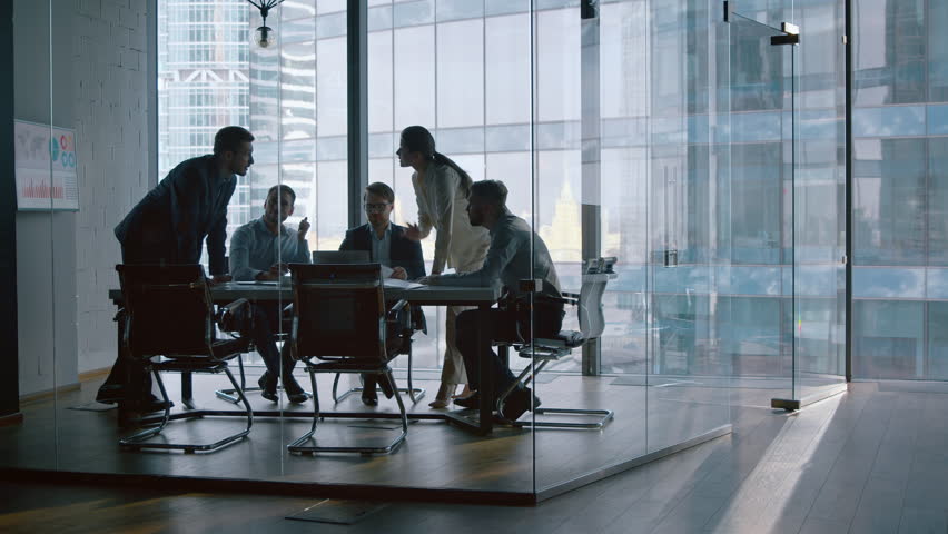 Young business people telling to CEO development vision at a meeting - Powered by Shutterstock - Get 15% off with code: PIKWIZARD15