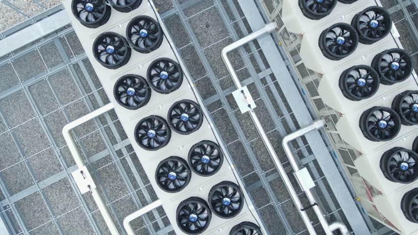 Cooling And Ventilation System Of Data Storage Center Warehouse Building. aerial topdown rotating shot