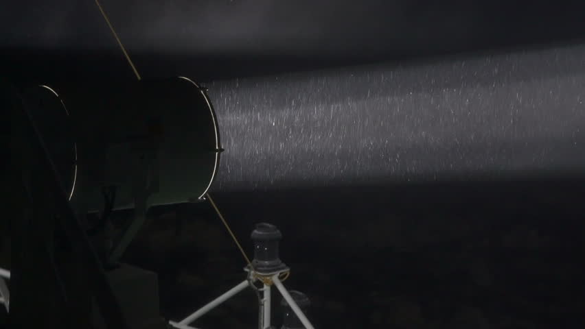 Searchlight beam in a snowstorm at night. Close up. Big searchlight on ship Royalty-Free Stock Footage #3475582837