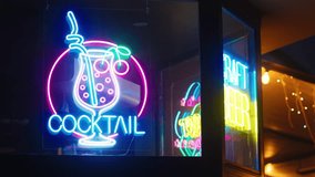 a neon sign for a cocktail bar is lit up at night - Powered by Shutterstock - Get 15% off with code: PIKWIZARD15