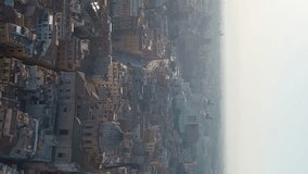 Vertical video. Rome, Italy. Vittoriano - Monument to the first king of Italy, Victor Emmanuel II. Flight over the city. Panorama of the city in the morning. Backlight. Summer, Aerial View