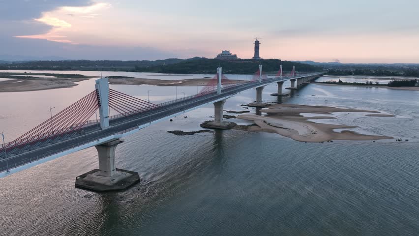 Aerial drone footage of Co Luy bridge crossing Tra Khuc river in Quang Ngai, Vietnam