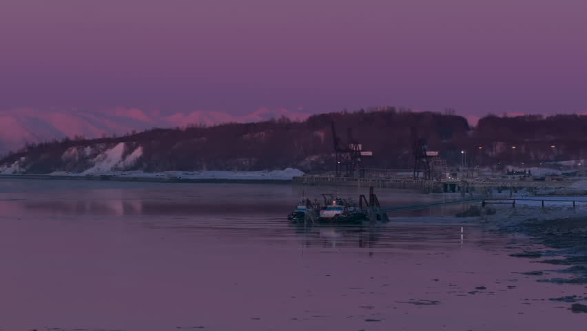 Alaska winter boat with pink mountains