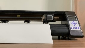 paper plotter. flatbed plotter. making stickers. slow motion video. High-quality shooting in 4K format.