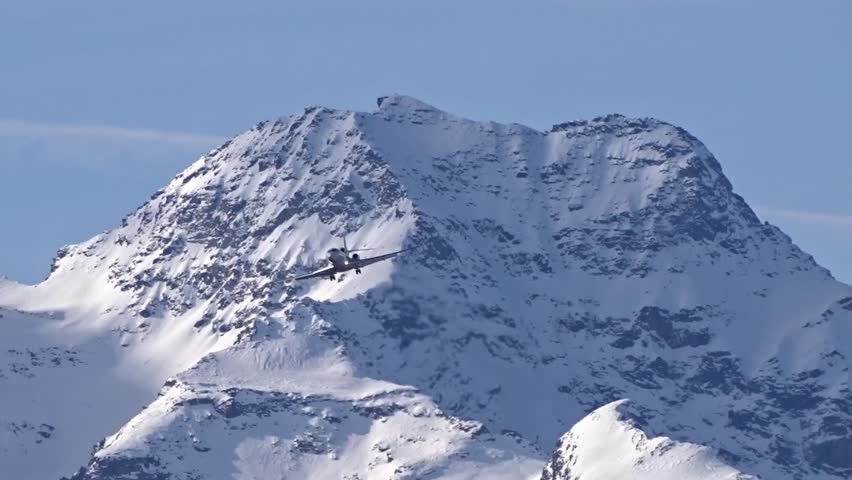 private jet high end luxury vip money rich flying final approach for landing snow covered mountain winter landscape background airplane Royalty-Free Stock Footage #3475811785
