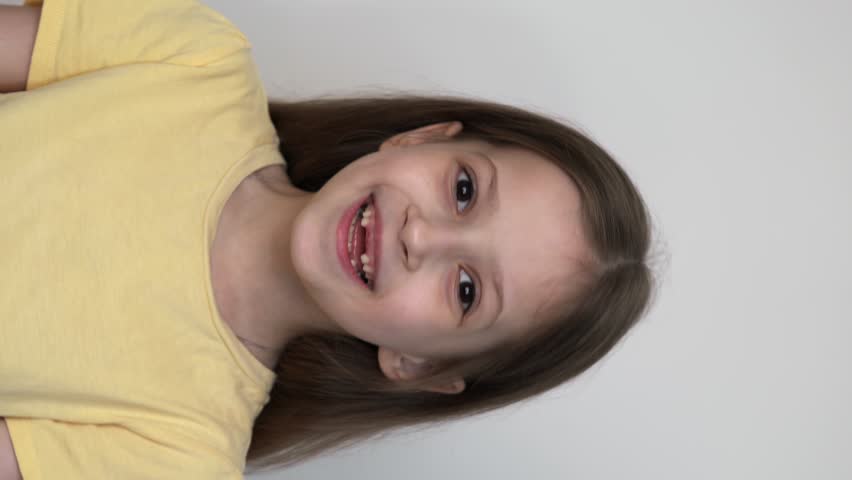funny smiling little girl without front tooth