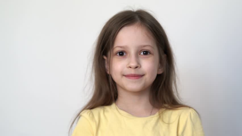 funny smiling little girl without front tooth