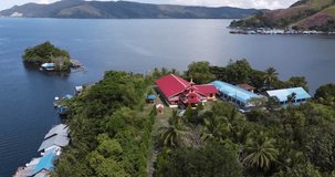 
Drone video footage of Asei Island, one of the small islands in the eastern part of Lake Sentani with an old church building and the traditions and culture it keeps