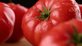 Super macro shot of a ripe tomato. A drop rolls over the surface of a tomato. The concept of delicious food and good harvest. - Powered by Shutterstock - Get 15% off with code: PIKWIZARD15