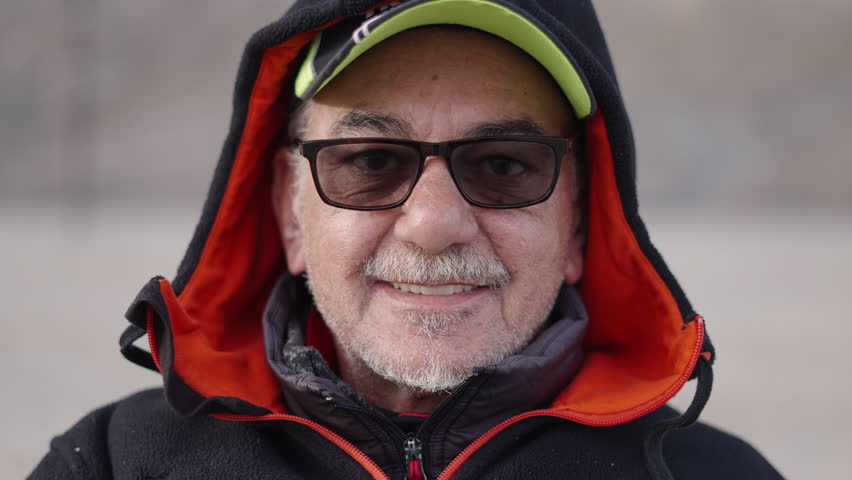Closeup of an elderly fisherman with glasses