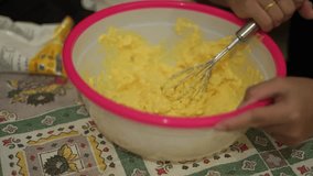 Eid cake dough is prepared in a vessel consisting of a mixture of butter, eggs and granulated sugar.
