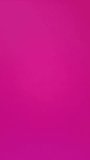 Blank rectangular white piece of paper appears on pink background. Vertical Stop motion animation. Space to insert text on white sheet of paper