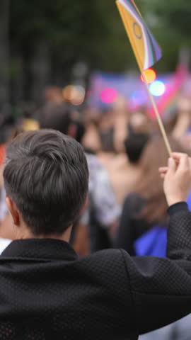 Many lesbian people wave rainbow flag. Crowd walk city street. Fun lgbt community symbol. Stop no homophobia concept. Pride fest. Bi gay woman go csd love day. Queer culture parade. Hold colorful flag