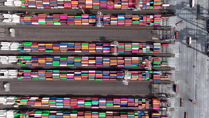 4K Drone shot of modern industrial container port of Rotterdam with containers from top view. It is an import and export cargo port where is a part of shipping dock Royalty-Free Stock Footage #3476319815