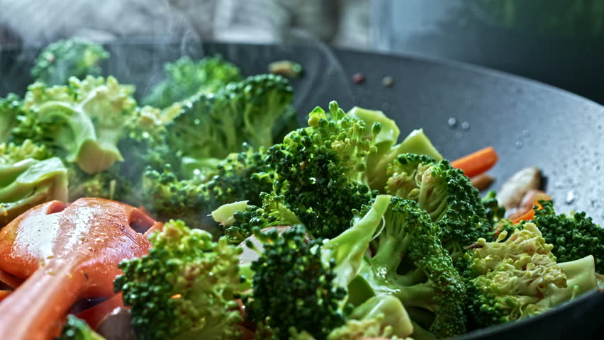 Dazzling Preparation Of Sautéed Vegetables, Rising Steam Reveals Aromas Of Mushroom, Broccoli, Carrot, Red Cabbage And Spices