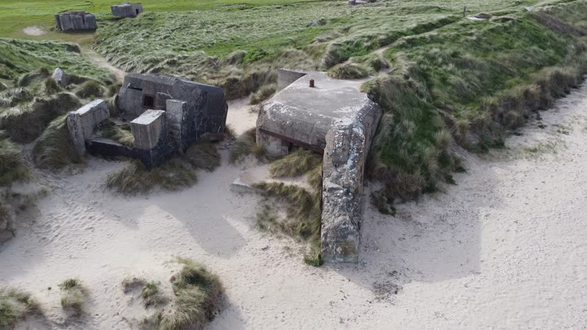 WW2 History, Atlantic wall bunkers over the coast of Normandy, France (utah beach) - Aerial view D-Day.