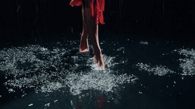female legs feet close-up barefoot stepping through puddles wet road adult girl walks in rain night city street moon light in water splash. happy woman in black studio slow motion, wet red dress 4k - Powered by Shutterstock - Get 15% off with code: PIKWIZARD15