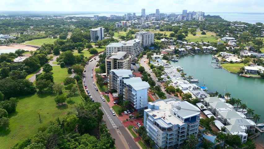 Aerial Drone of Cullen Bay and Marina With Cars Driving Along Road in Darwin NT Australia