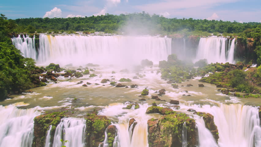 Timelapse of Waterfalls of Iguazu around a big green area, in a sunny day, Foz do Iguacu, Parana, Brazil Royalty-Free Stock Footage #3476662325