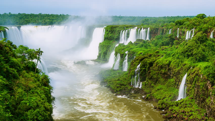 Timelapse of Waterfalls of Iguazu around a big green area and a river, in a sunny day, Foz do Iguacu, Parana, Brazil Royalty-Free Stock Footage #3476665049
