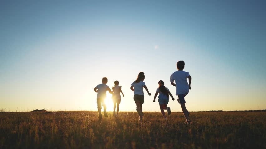 children running in park silhouette. people in park. children a kid together run in park at sunset silhouette. group of children run. happy family and little baby child lifestyle summer