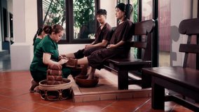 Masseuse washing feet of couple customer and wipe the water with a towel in spa salon. Relaxation foot massage. - Powered by Shutterstock - Get 15% off with code: PIKWIZARD15