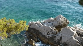 Surf and rocks near Saint Stephen's Island, Montenegro.