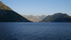 Sea coast and mountains of Montenegro, view from the deck of a motor boat. Bay of Kotor.