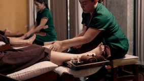 Asian woman professional masseuse acupressure massage on feet of customer. Masseuse service foot massage to woman customer. Relaxation foot massage in spa salon. - Powered by Shutterstock - Get 15% off with code: PIKWIZARD15