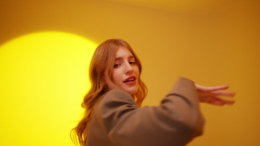 Fancy young woman 20s years old dance fool around have fun gesticulating with hands