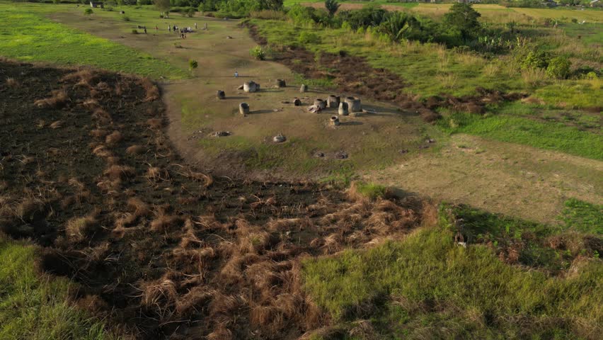 Ancient Wonders from Above: Aerial View of Megalithic Site in Central Sulawesi
Explore the ancient mysteries of Central Sulawesi with this captivating aerial footage of a megalithic site.
 Royalty-Free Stock Footage #3476784023