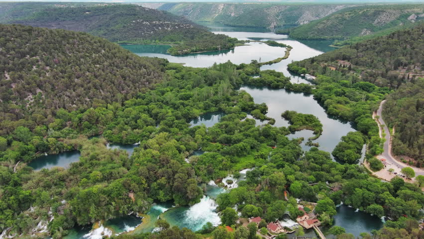 Aerial high view of beautiful Krka National Park, green foliage and turquoise water, Croatia, 4k