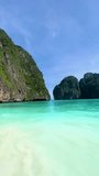 Clear empty beach on a sunny day at maya bay in krabi, in thailand thai island hopping. beautiful national nature reserve world famous most beautiful beach white sand and clear sea water calm waves