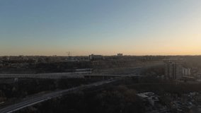 Drone video moving towards the mountain in Hamilton Ontario at sunset