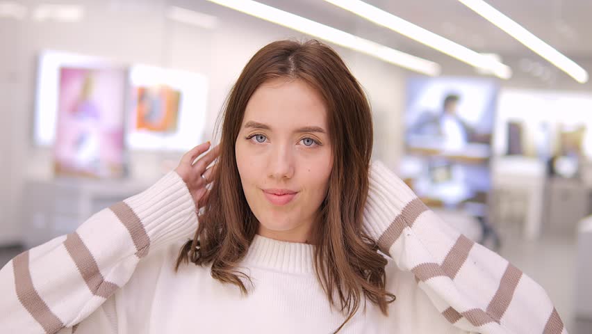 Portrait of a Gorgeous Dark Haired Woman Smiling Charmingly while Standing in the Middle of Modern mall. Happy Young Woman Enjoys Life 4K Royalty-Free Stock Footage #3476964155