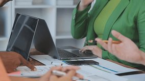 Financial Strategy Meeting, Asia Business Analysis, Zoom into a business meeting where Asian professionals analyze statistics and brainstorm financial strategies, with team members taking notes - Powered by Shutterstock - Get 15% off with code: PIKWIZARD15