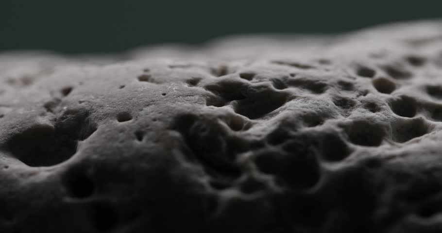 Volcanic Rock Texture with Natural Pores. Close-up, shallow dof.