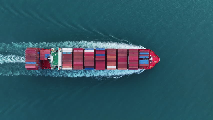 Cargo Container experss ship running very fast in the ocean. Container ship carrying container import export concept technology freight shipping by ship. aerial top of express Container Vessel 