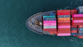 Top view Cargo Container ship the ocean ship carrying container and running for import export concept technology freight shipping by ship	
. aerial top of Container Vessel running in green sea - Powered by Shutterstock - Get 15% off with code: PIKWIZARD15