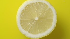 Lemon slices with mint leaf rotation background. Close-up of a delicious ripe lemon rotate and aromatic mint. Healthy food, cooking ingredient. UHD video footage. Ultra high definition 3840X2160