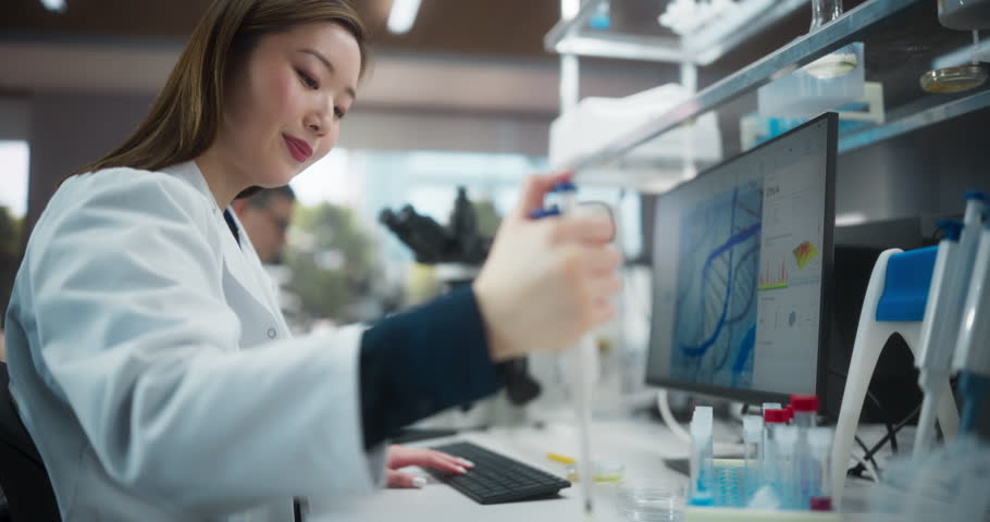 Portrait of a Beautiful Asian Female Scientist Using Micro Pipette for Medical Research Project. Advanced Scientific Lab for Medicine, Biotechnology, Microbiology Development