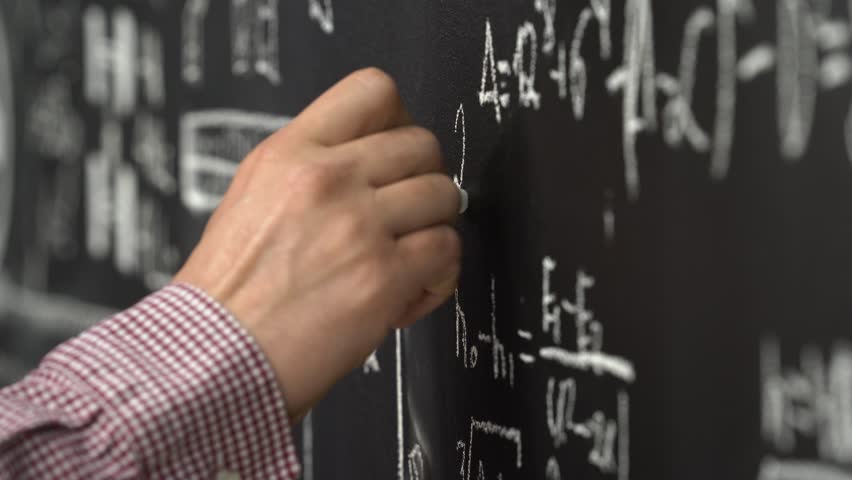 A male hand writing on blackboard. Man's hand writing with chalk on board. Close view teacher's hand writing on blackboard in classroom. Professor teaching math on blackboard.  - Powered by Shutterstock - Get 15% off with code: PIKWIZARD15
