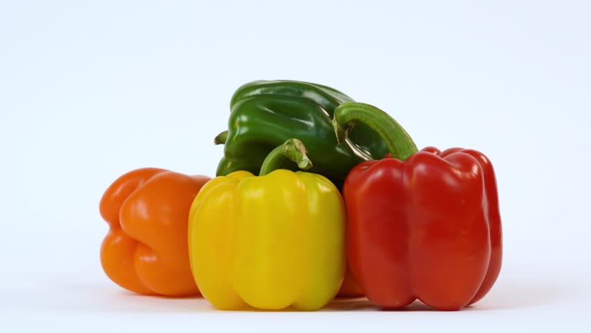  Sweet bright colors pepper on white. Peppers set isolated on white background, sweet peppers collection. Rotating, 4k. Advertisement for supermarket. Free space for text. Copy space.
